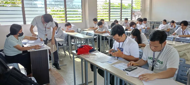 Students answering a handwritten exam